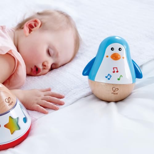 Hape Stehauf-Pinguin - Babyspielzeug aus Holz mit klingelnder Glocke, blau, Motorik- und Gleichgewichtsförderung, sensorisches Lernspielzeug für Babys ab 6 Monaten – Bild 5